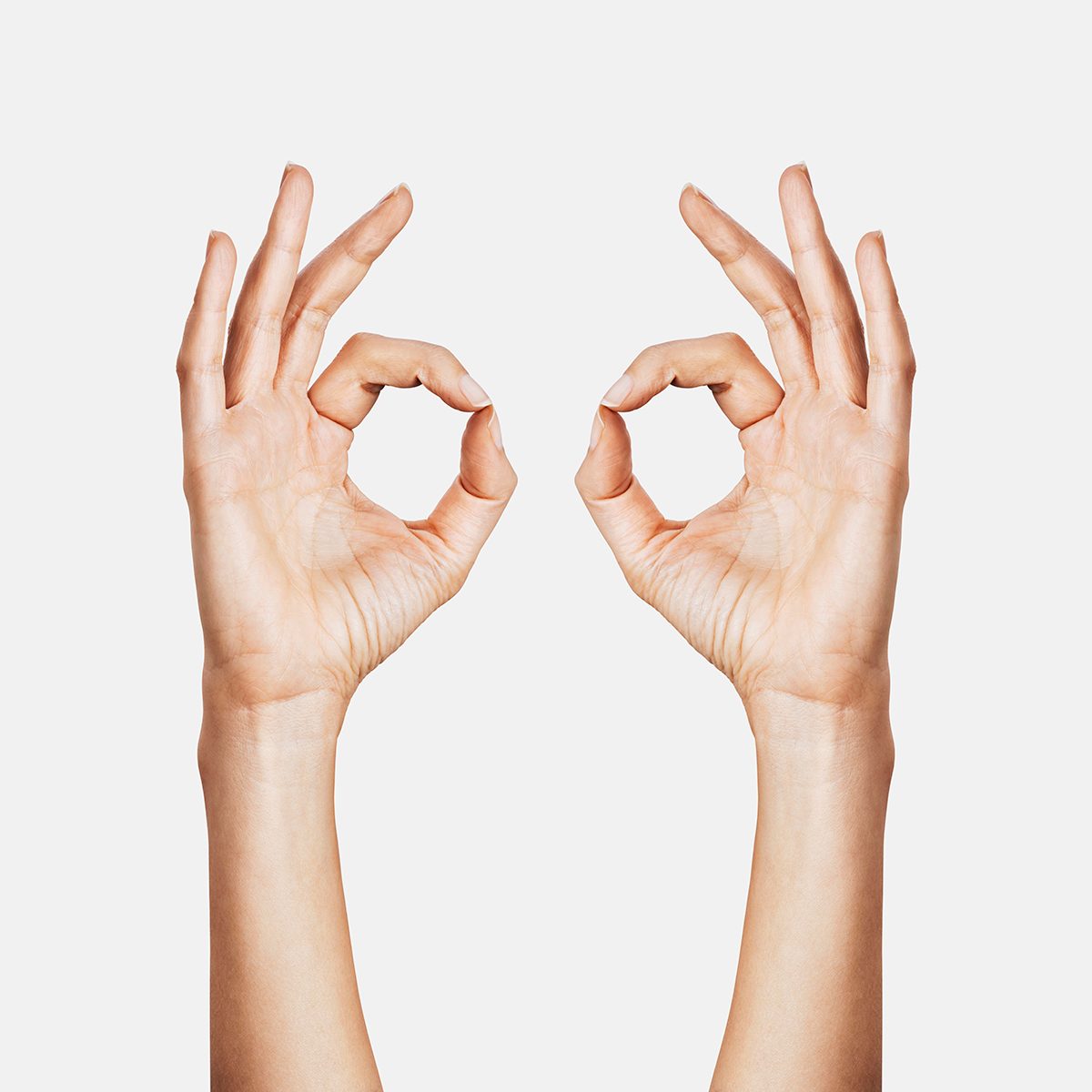Two hands doing the OK hand sign
