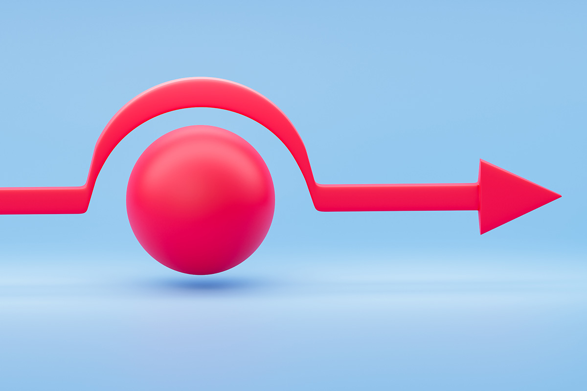 A red arrow going over a red ball on a blue background