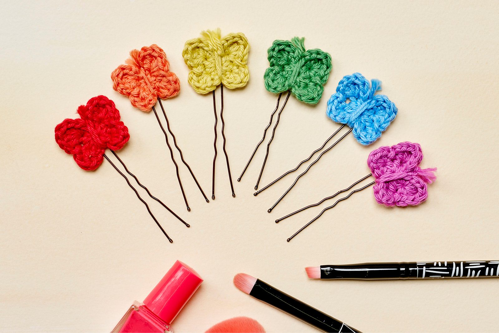 Crochet rainbow-coloured butterfly hair pins