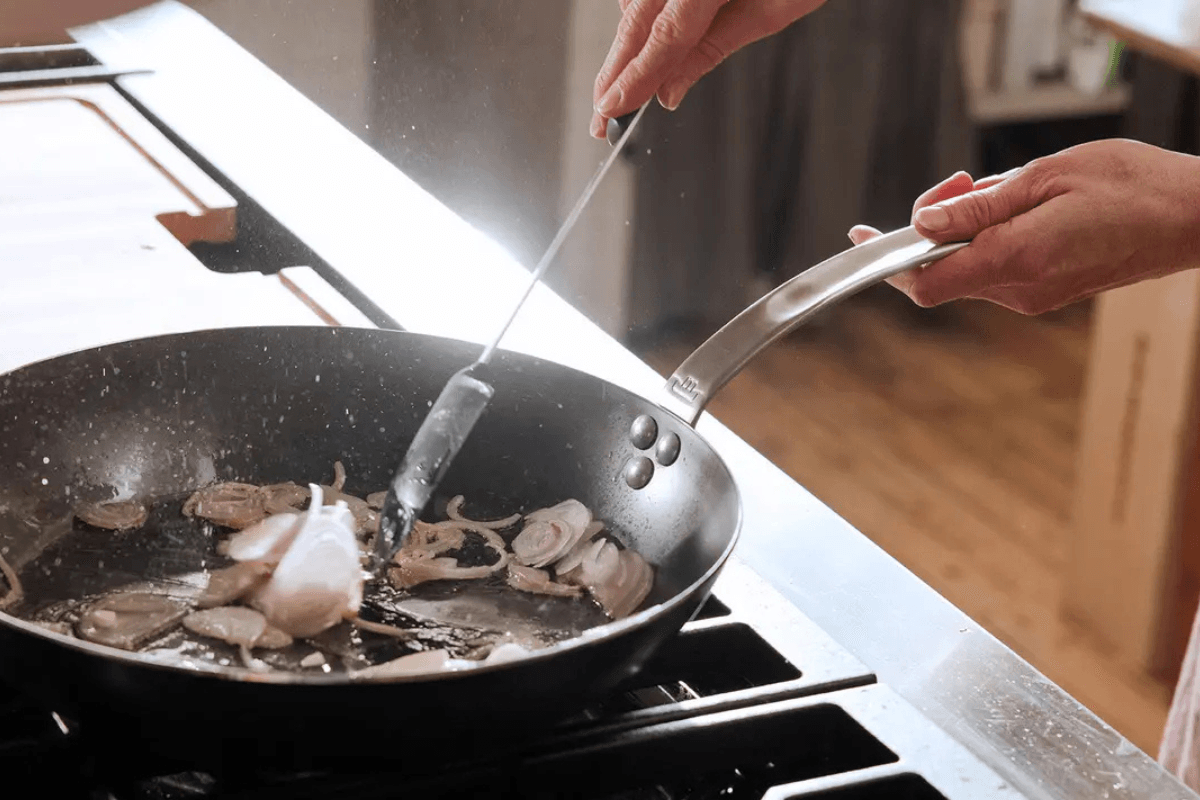 Frying onions in a pan.