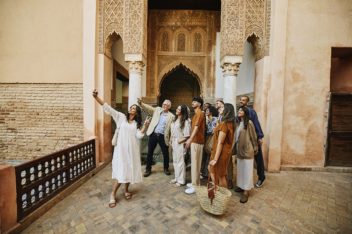 A group of tourists taking a selfie outside the Saadian Tombs