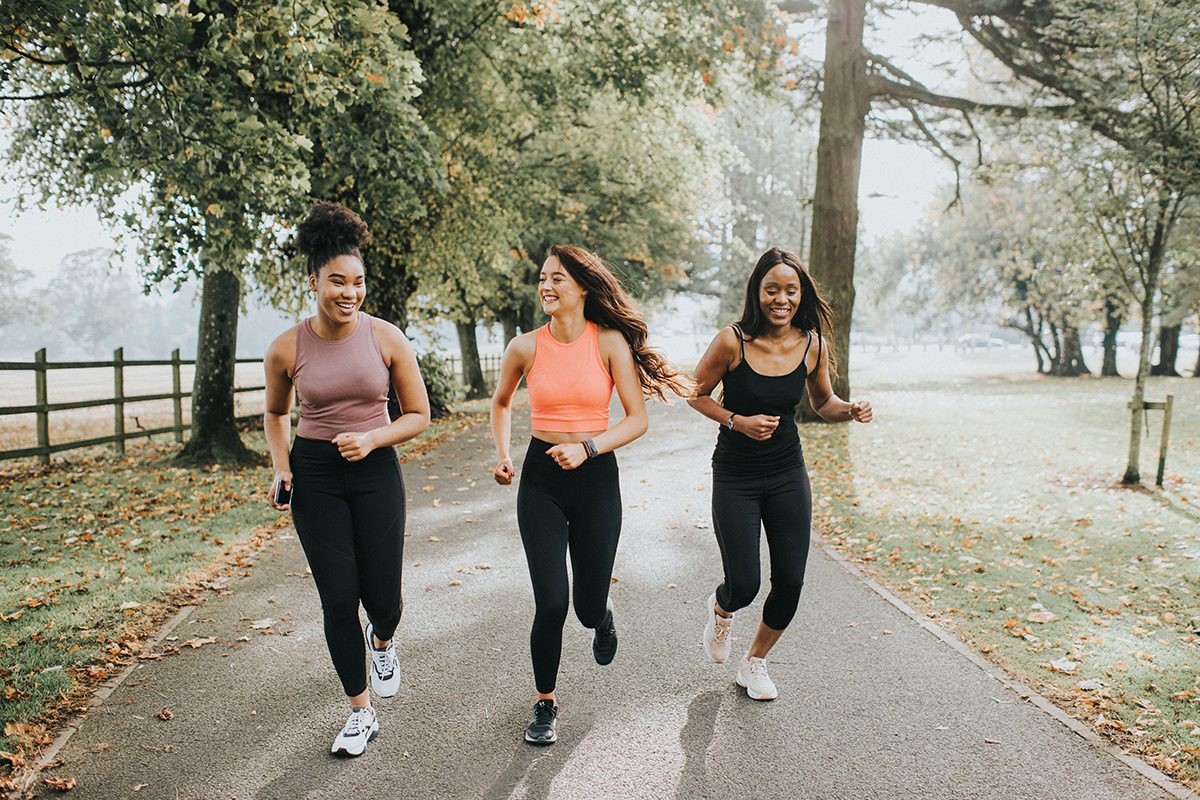 Three women jogging in a park