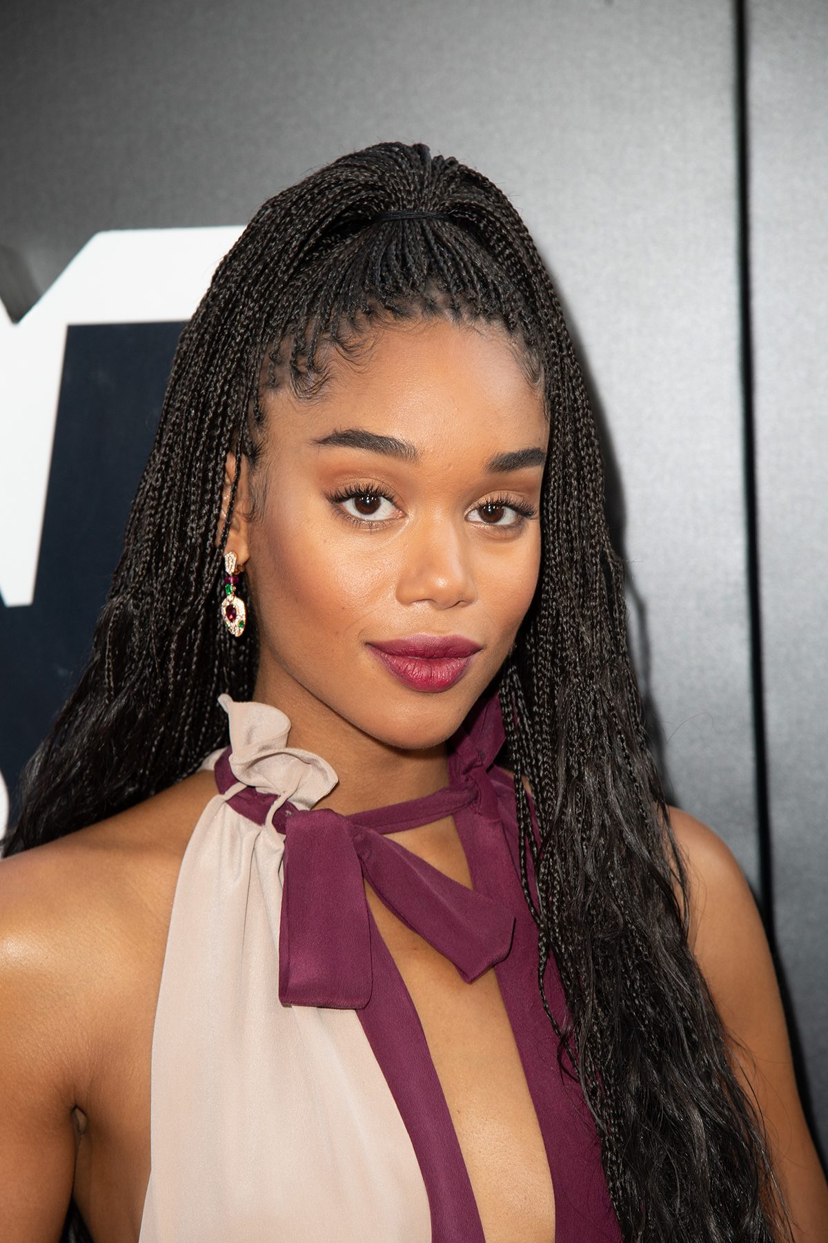 A medium close-up of Laura Harrier, taken at a premier
