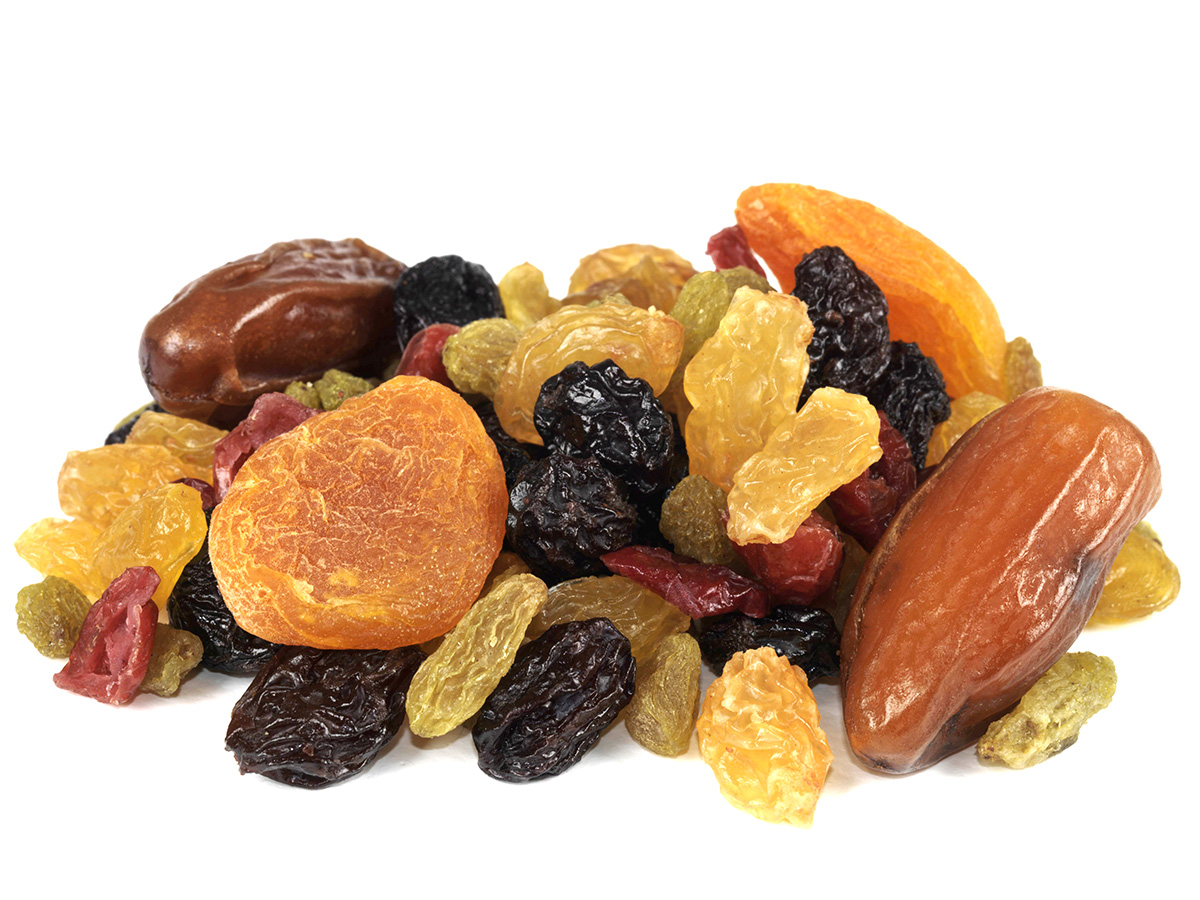 A mix of dried fruits on a white background