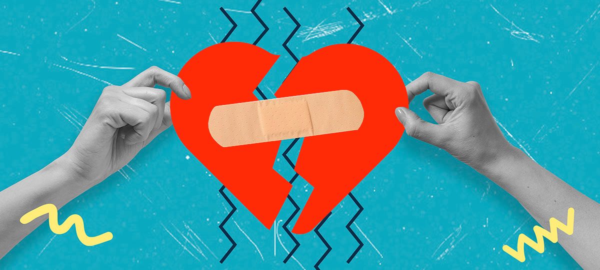 Two hands hold up two halves of a broken heart, which are joined by a plaster