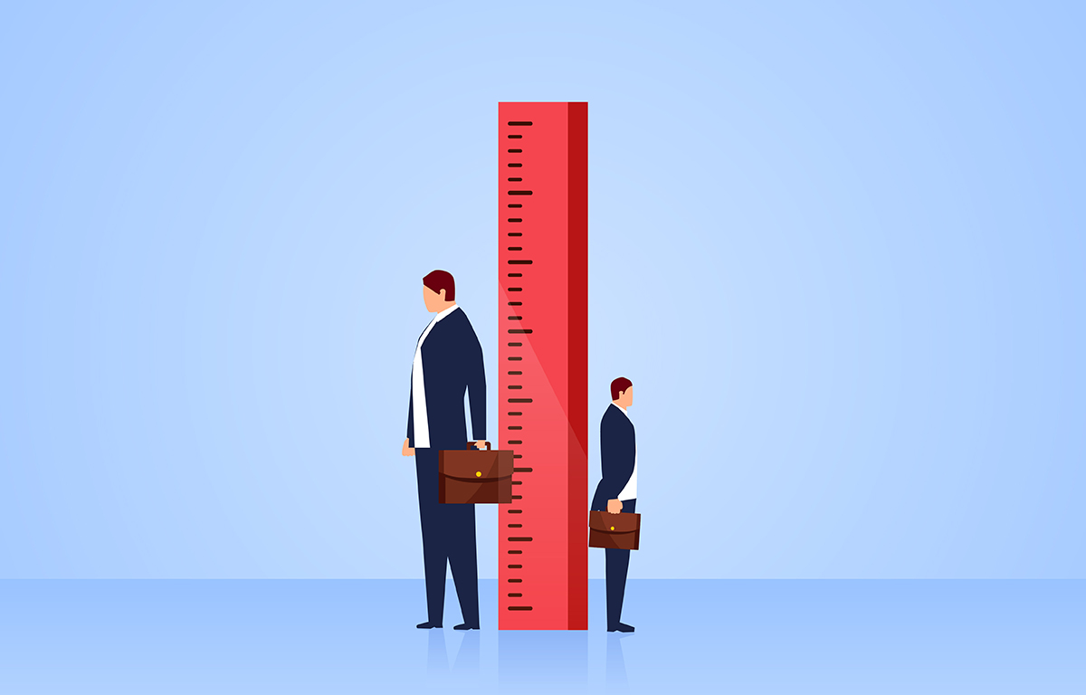 A stock illustration of two differently-sized businessmen standing next to a ruler