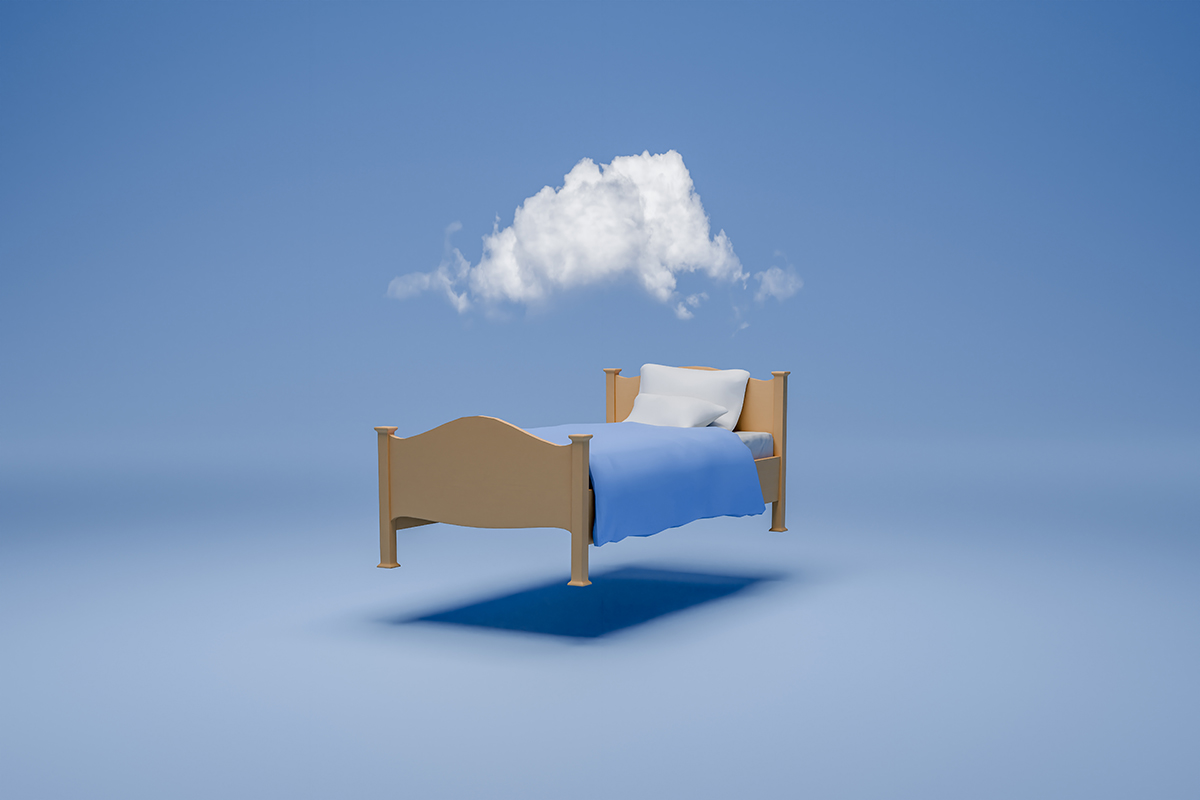 A bed with a cloud floating above it against a blue background