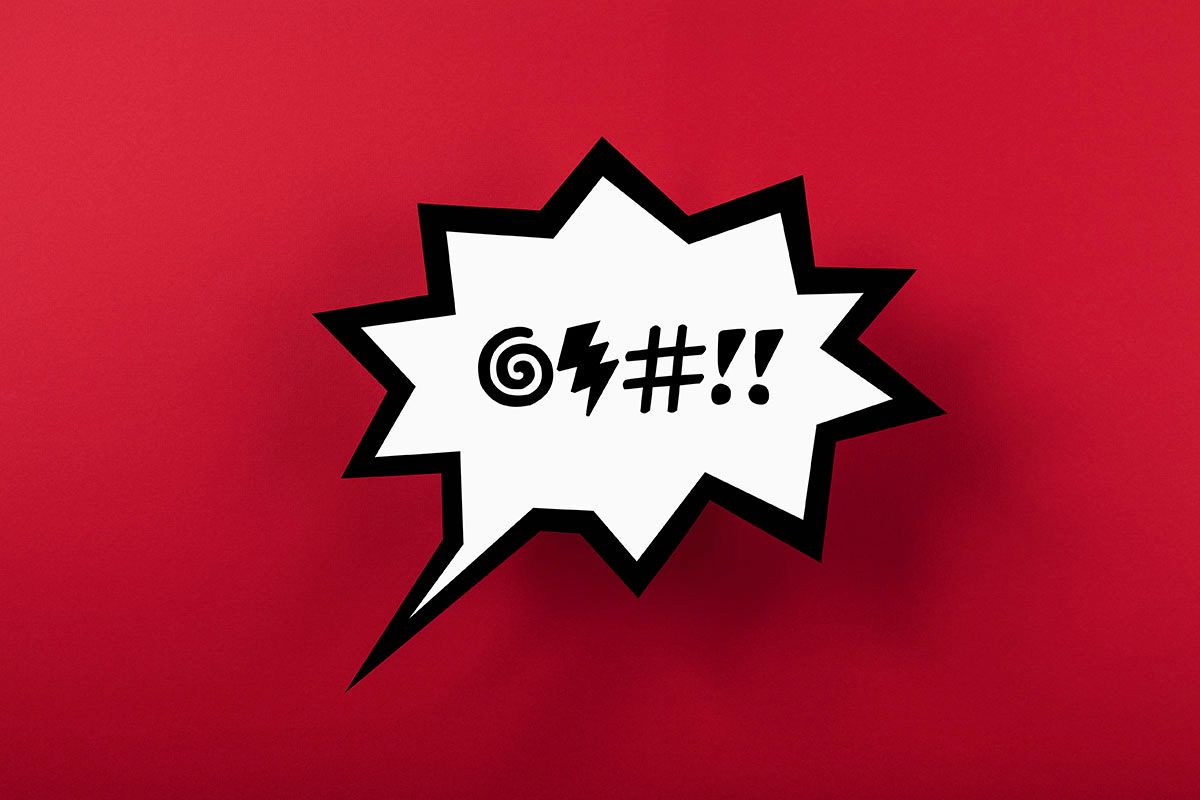 A speech bubble featuring symbols to represent swearing, against a red background