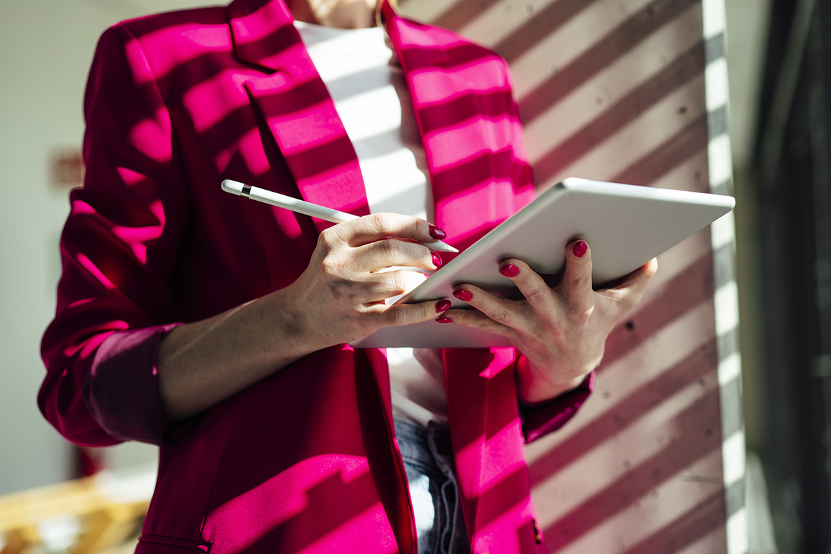 A woman writing in a notepad