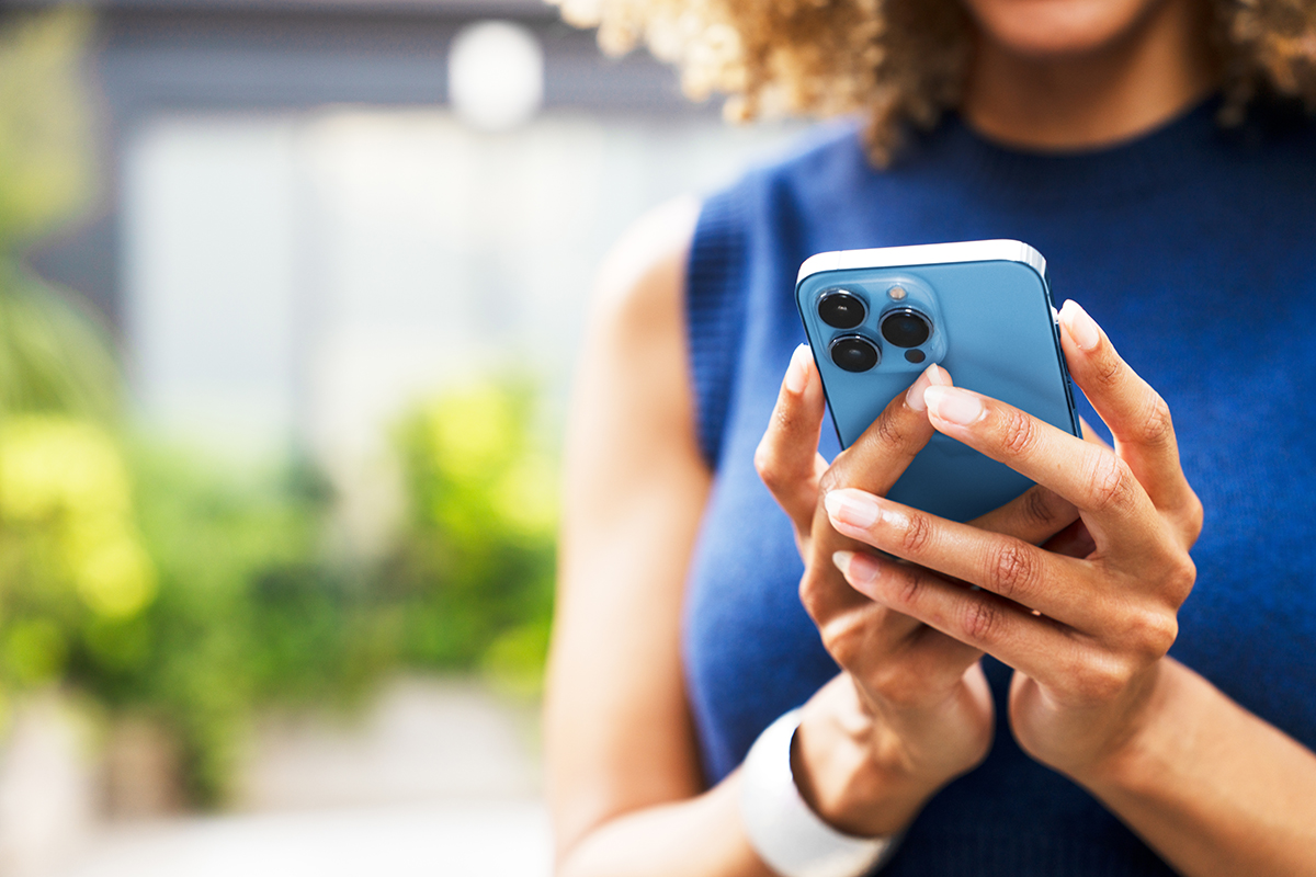 A woman holding a smart phone