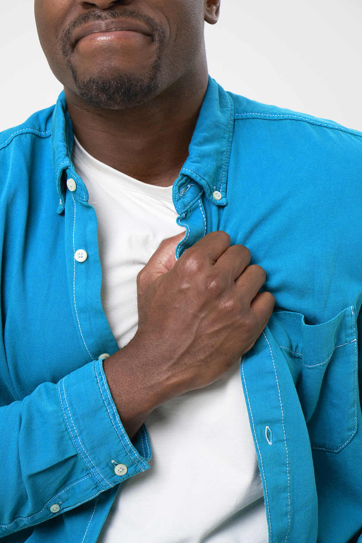 A man clutching his chest in pain