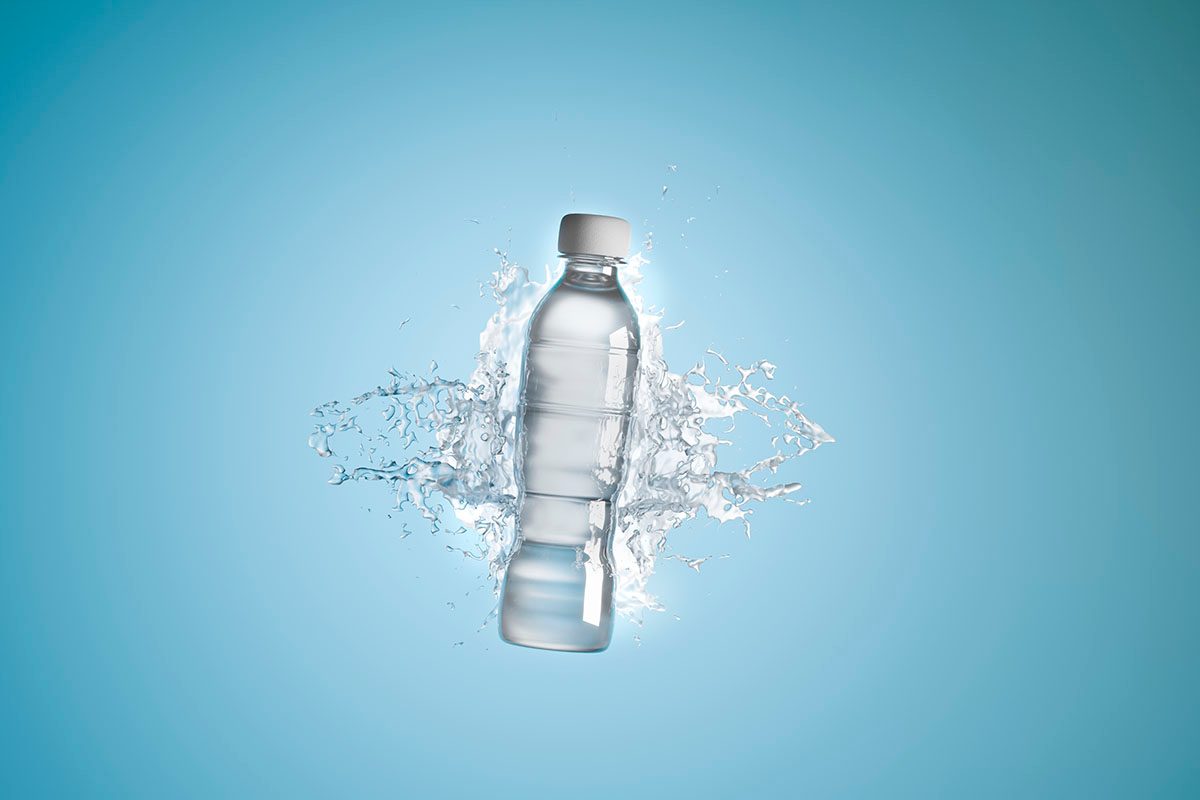 A digitally-generated image of a plastic water bottle creating a splash in clear water