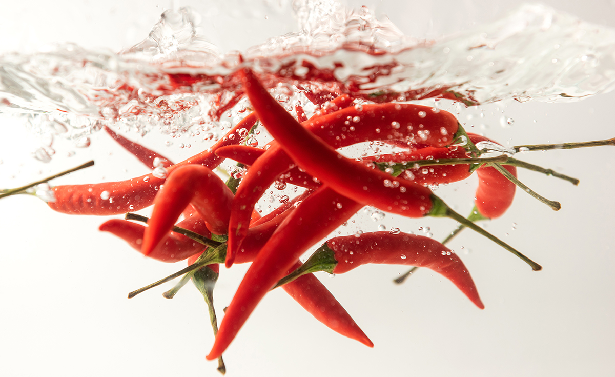Red chillies submerged in water