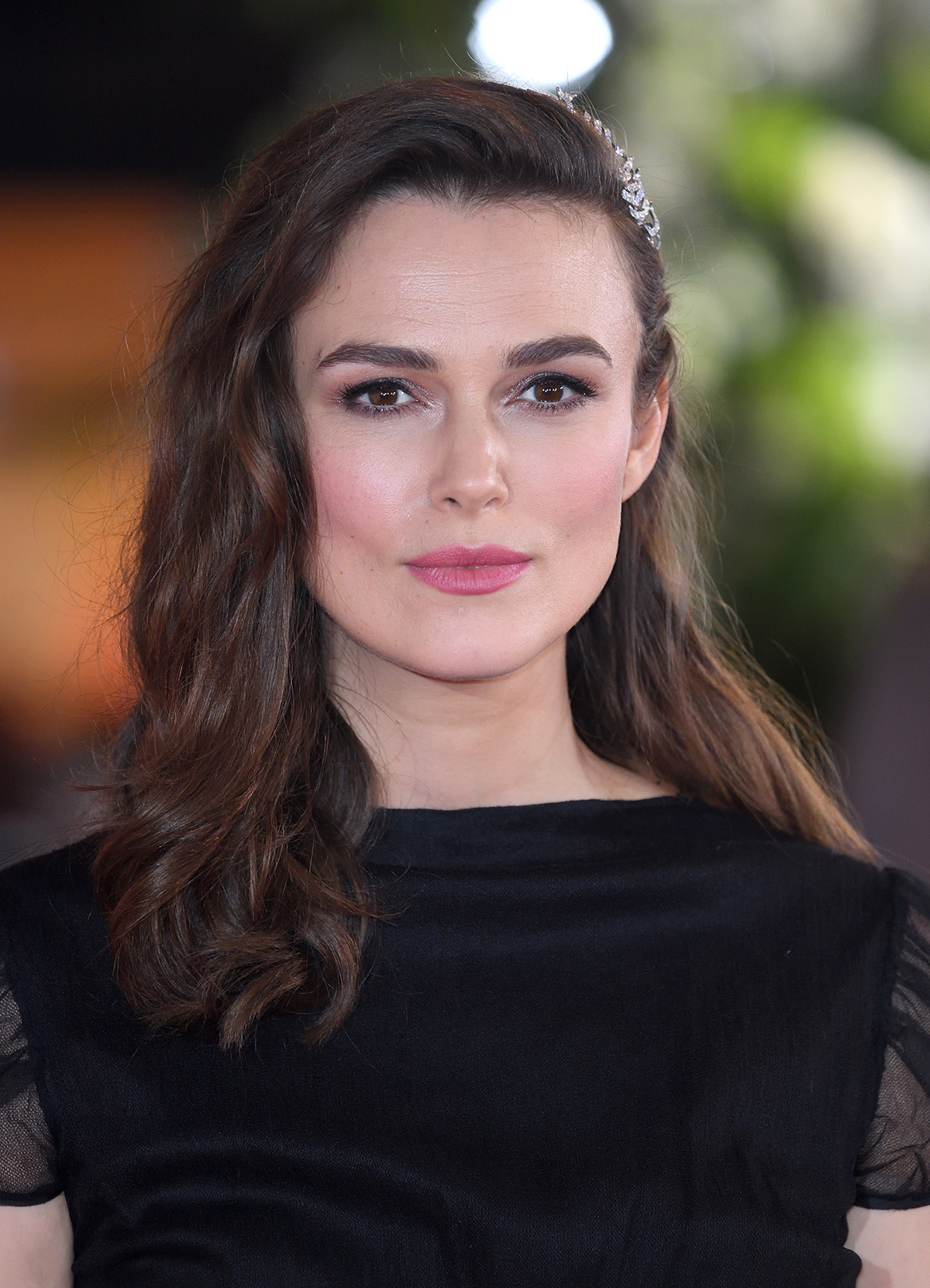 A medium close-up of Keira Knightley against a blurred background