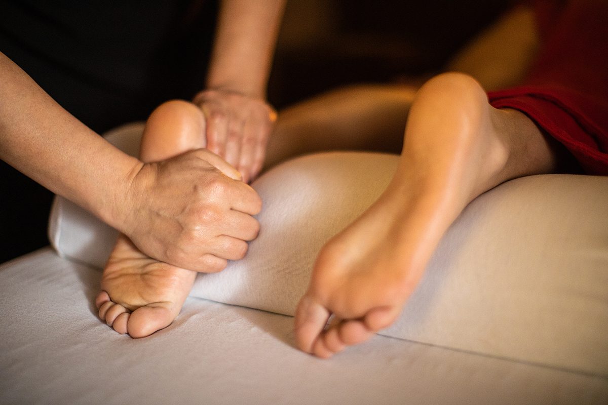 A close-up of a foot massage in a spa