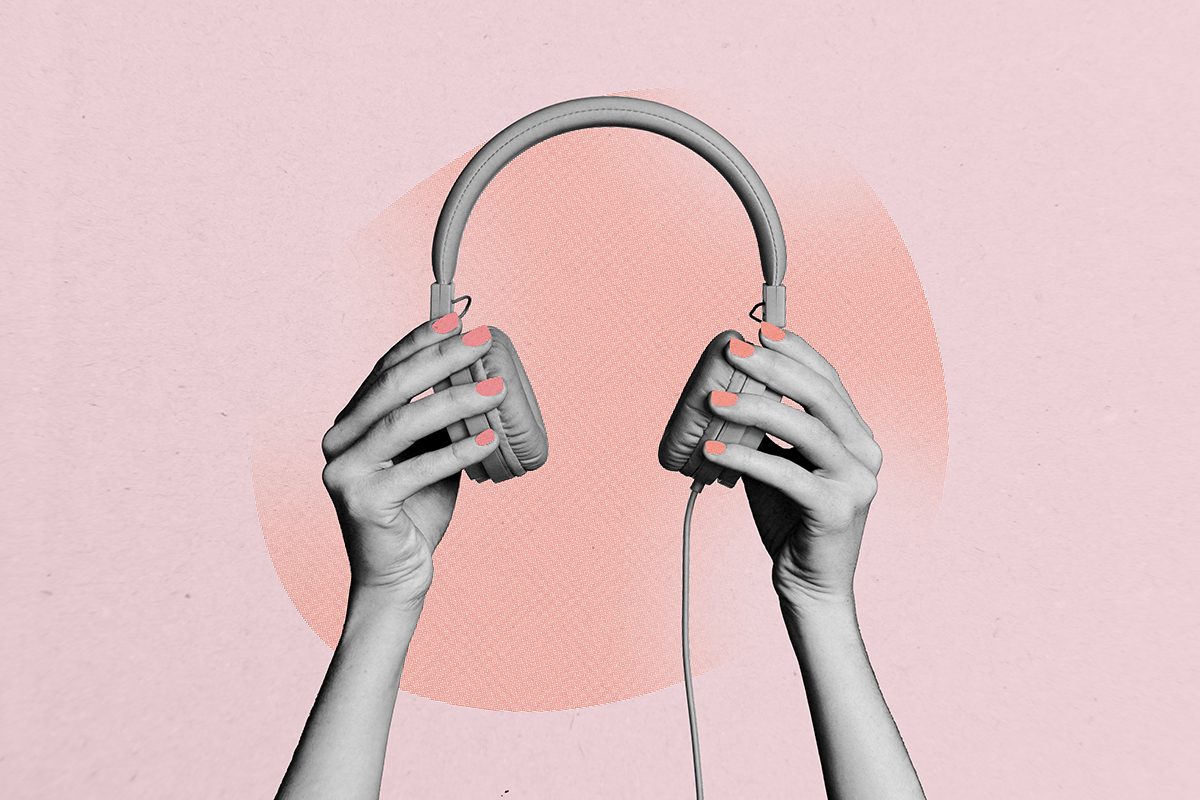 Hands holding headphones