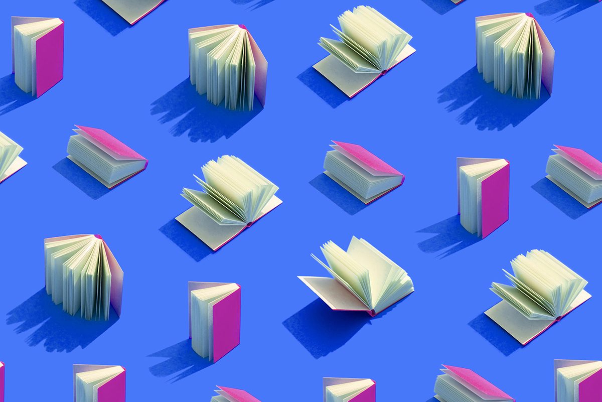 Books with a purple cover are arranged in a pattern on a blue background