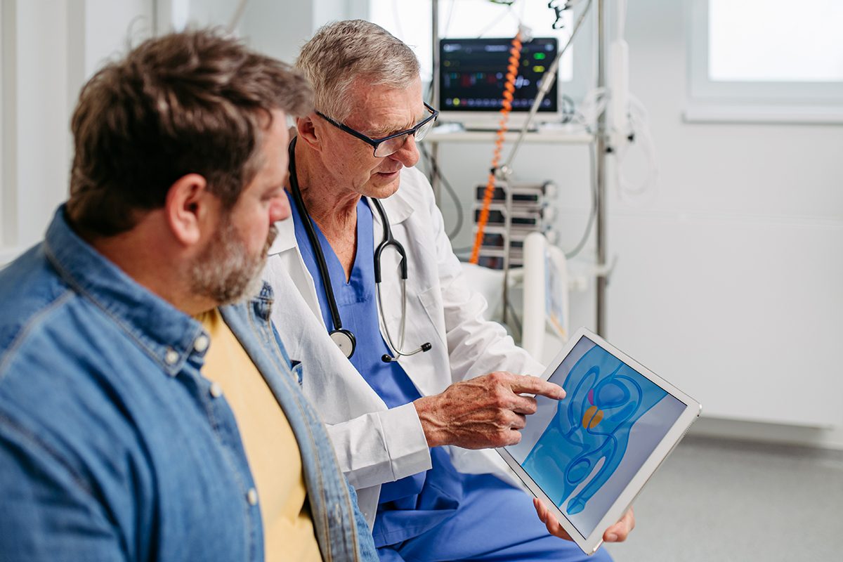 A doctor discussing the results of a prostate examination with a male patient