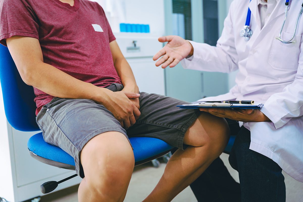 A male patient talking to a doctor
