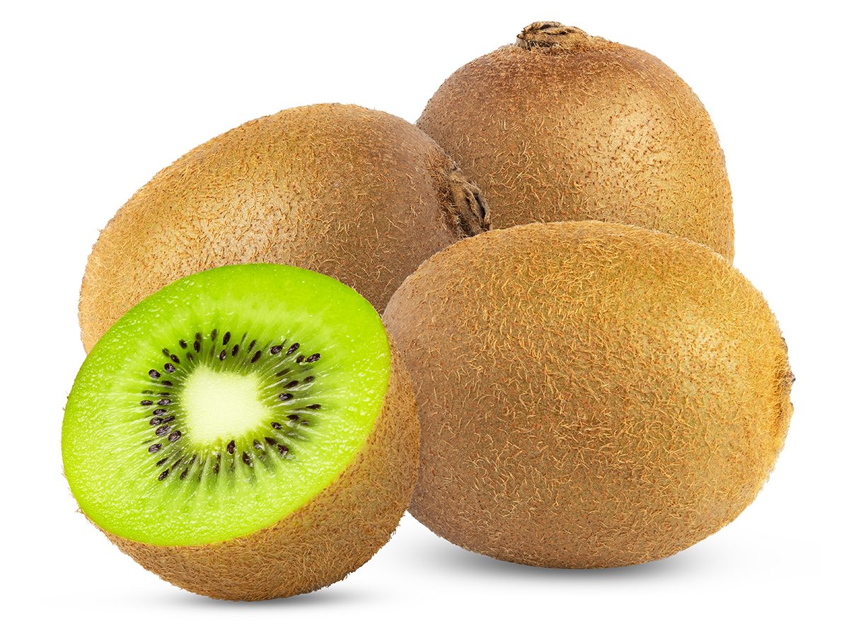 Three whole kiwi fruits and half a kiwi fruit against a white background