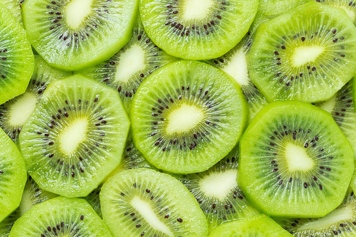 A pile of sliced kiwi fruit