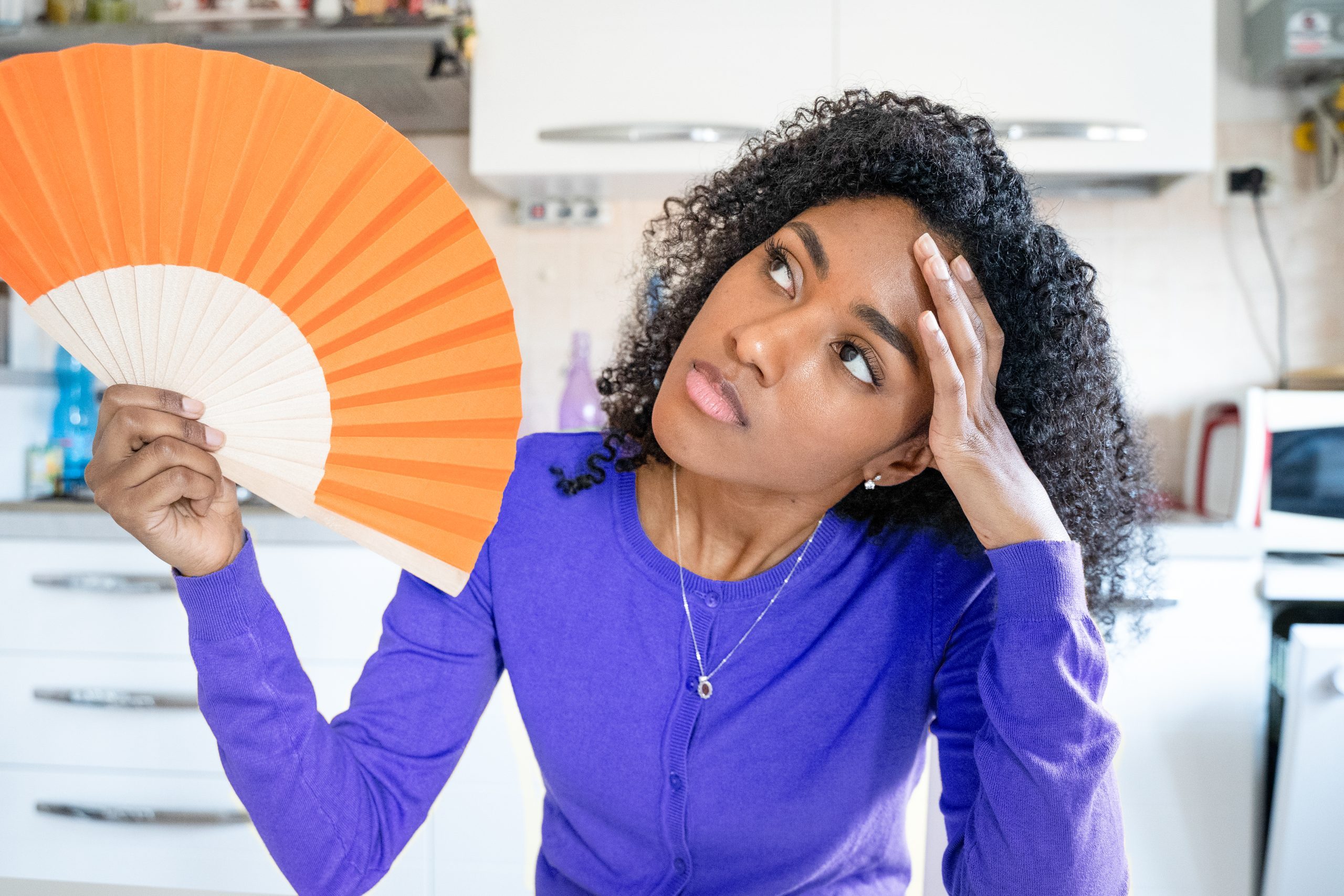 One black woman trying t o refresh from summer heatwave