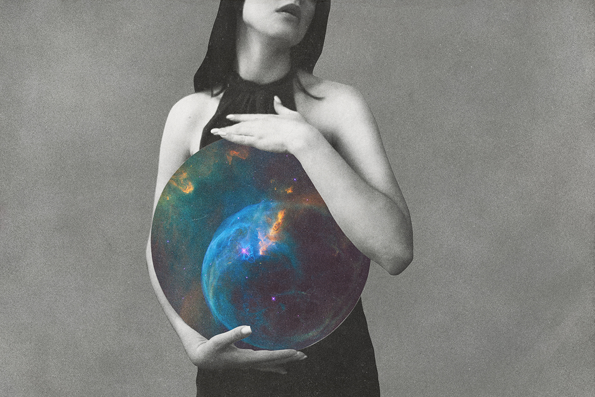 A black-and-white image of a woman holding a circle featuring a galaxy against her body