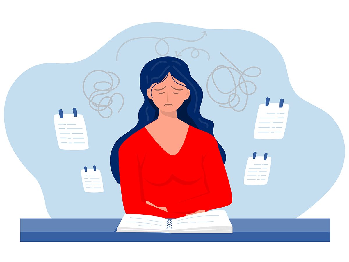  An illustration of a stressed woman sitting at a desk, surrounded by to-do lists and tangled scribbles to represent jumbled thoughts