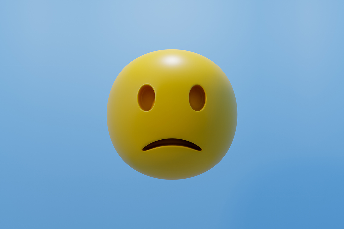 A round, yellow frowning face emoji is set against a blue background.