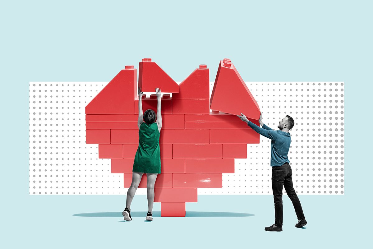 A collage style image of a man and a woman building a heart using large lego pieces