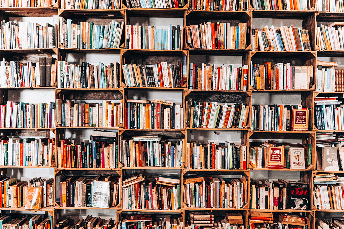 A large bookshelf stacked with books in a bookstore.