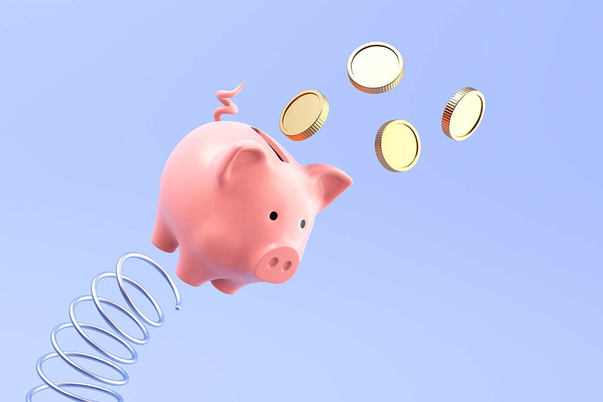 A piggy bank is launched from a spring, with coins falling from its slot, against a pale blue background