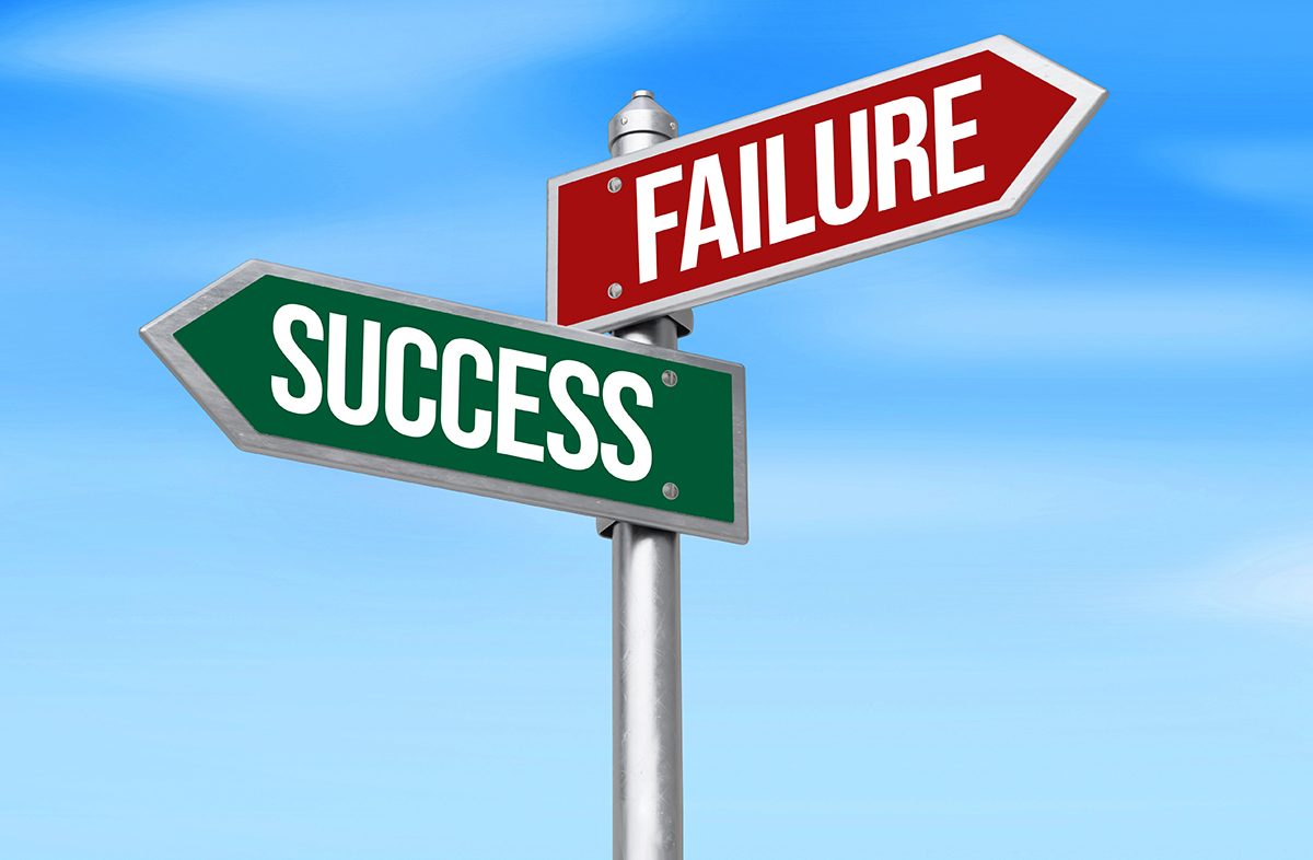 A signpost pointing towards 'FAILURE' in one direction and 'SUCCESS' in the other
