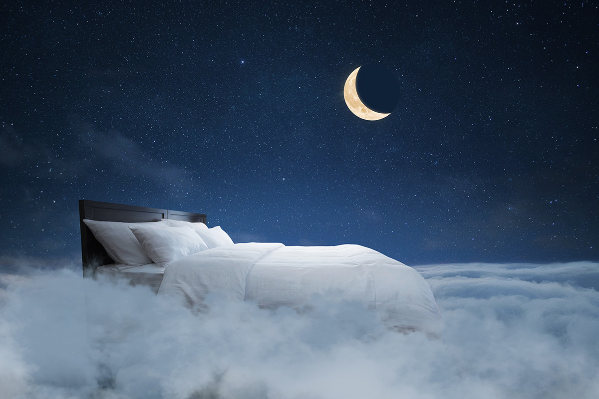 A bed floating amongst clouds in a night sky