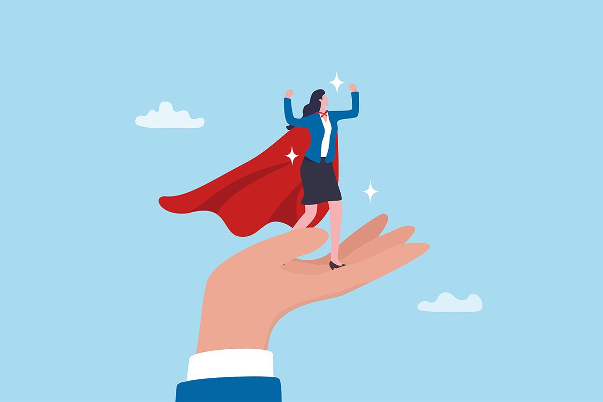 An illustration of a businesswoman wearing a superhero cape standing on a large hand