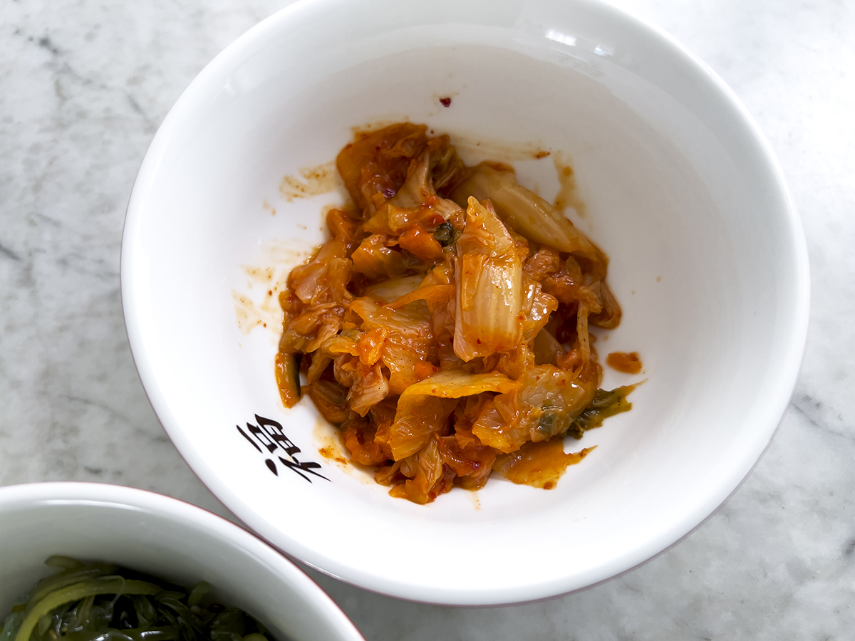 Kimchi in a white bowl