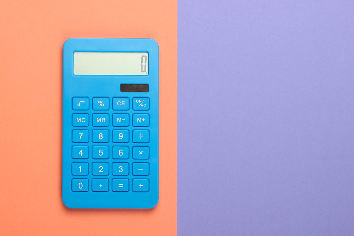 A blue calculator on an orange and purple background