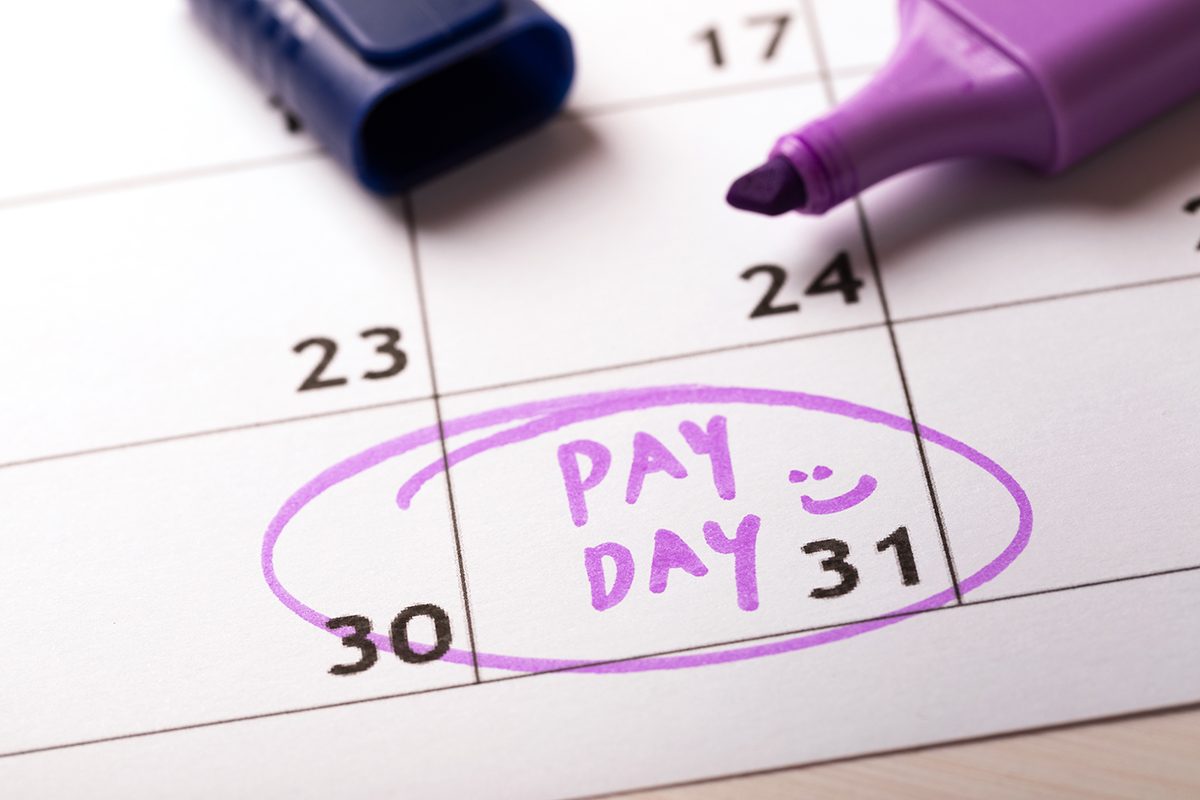 A calendar page with the 31st circled and 'PAY DAY' written across it in purple highlighter
