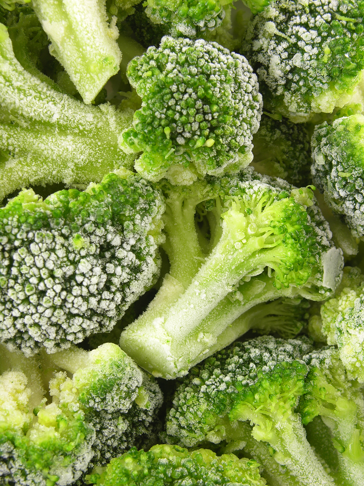 A close-up shot of frozen broccoli.