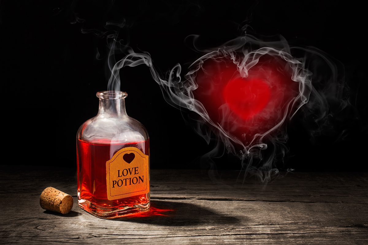 Heart-shaped smoke is rising from a love potion bottle