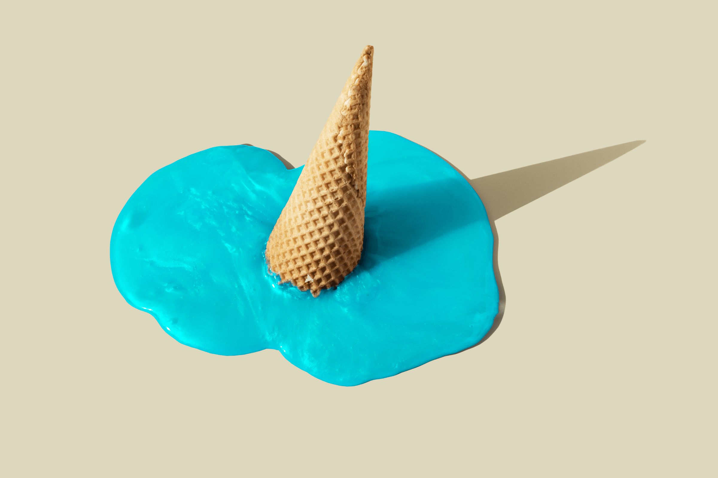 Melted blue ice cream with waffle cone